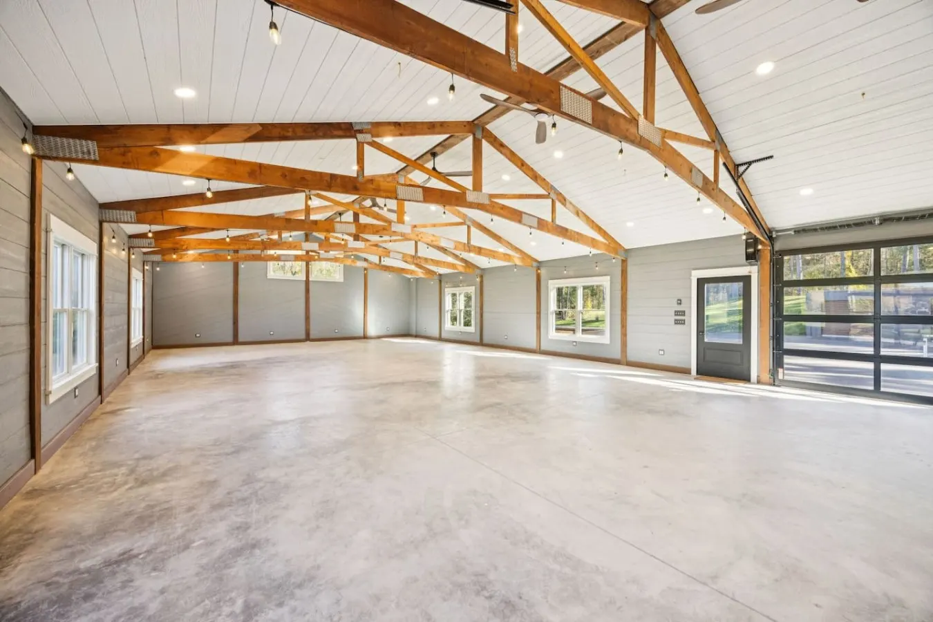 Open timber-truss hall with large windows
