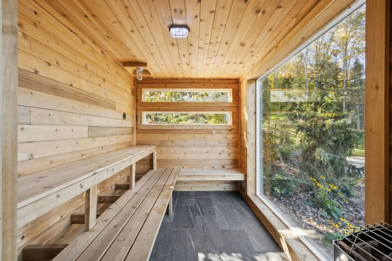 Cedar sauna with a window onto the woods
